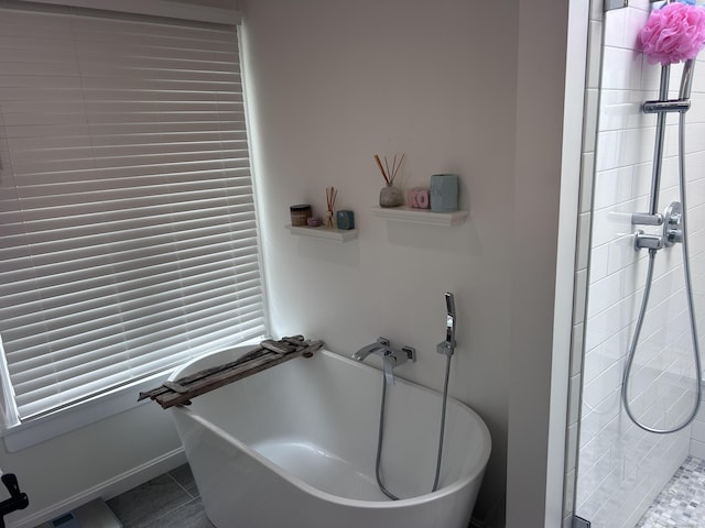 8 Sharon Ln, Old Saybrook, CT 06475 - bathroom featuring a freestanding bath, a stall shower, and tile patterned floors