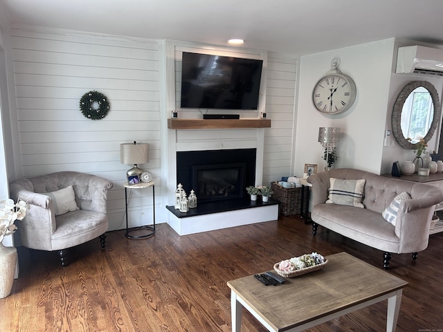 8 Sharon Ln, Old Saybrook, CT 06475 - living area featuring a wall unit AC, a fireplace, and wood finished floors