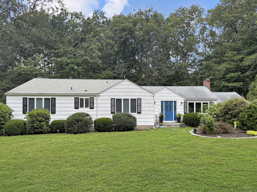 96 Moravia Rd, Avon, CT 06001 - ranch-style house featuring a front yard, a chimney, and view of scattered trees