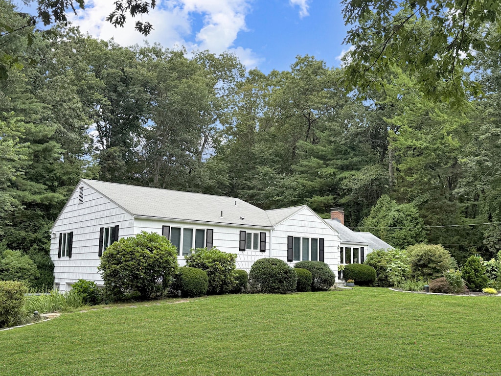 96 Moravia Rd, Avon, CT 06001 - ranch-style home featuring a chimney and a front lawn