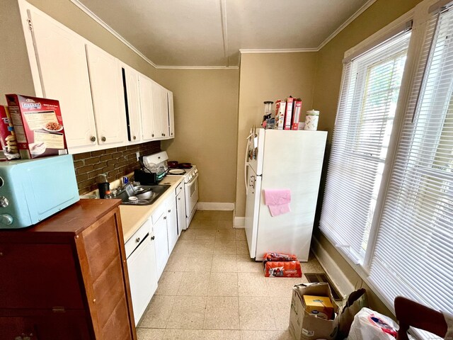 271 S Main St, Torrington, CT 06790 - kitchen featuring white appliances, decorative backsplash, ornamental molding, white cabinetry, and light countertops
