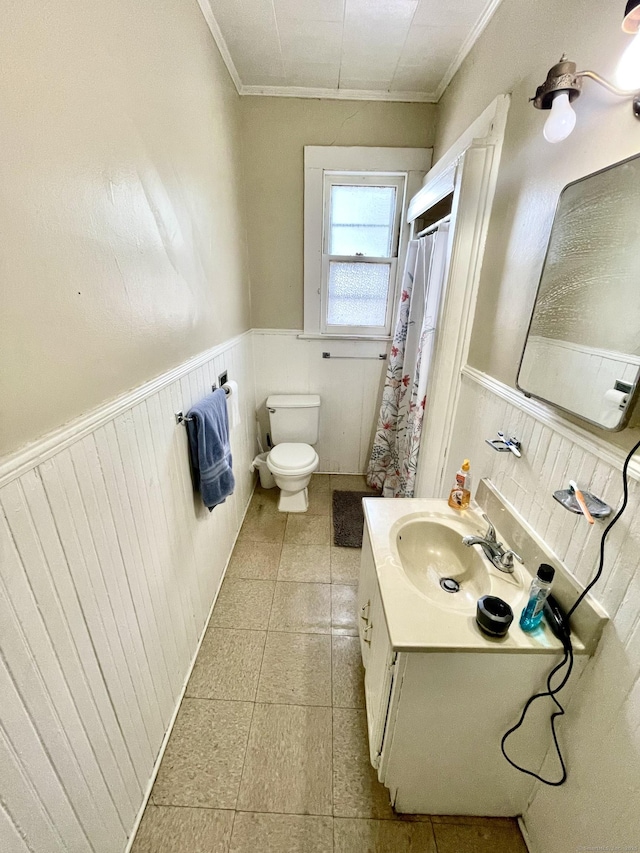 271 S Main St, Torrington, CT 06790 - bathroom featuring a wainscoted wall, vanity, crown molding, a shower with curtain, and tile patterned flooring