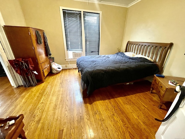 271 S Main St, Torrington, CT 06790 - bedroom with light wood-style flooring, crown molding, and cooling unit