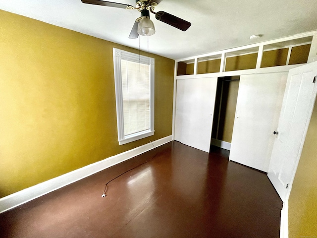 271 S Main St, Torrington, CT 06790 - unfurnished bedroom with concrete floors, ceiling fan, and a closet