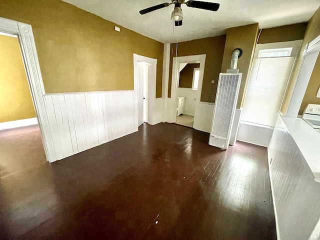 271 S Main St, Torrington, CT 06790 - unfurnished room featuring a heating unit, wainscoting, a ceiling fan, and washer / clothes dryer