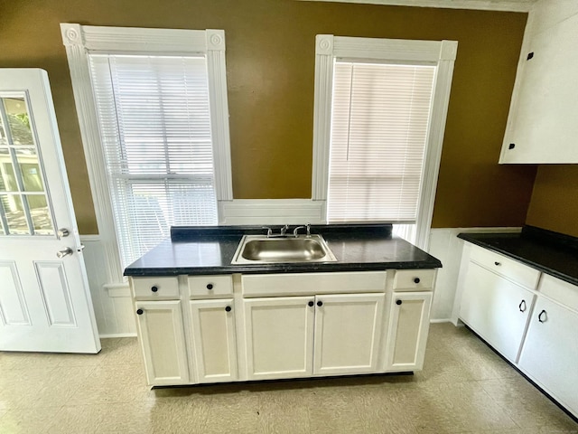 271 S Main St, Torrington, CT 06790 - kitchen with dark countertops and white cabinets
