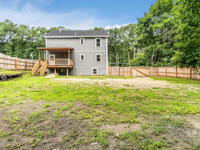 39 Beaver Brook Rd, Danbury, CT 06810 - back of house featuring stairs, a wooden deck, and a fenced backyard
