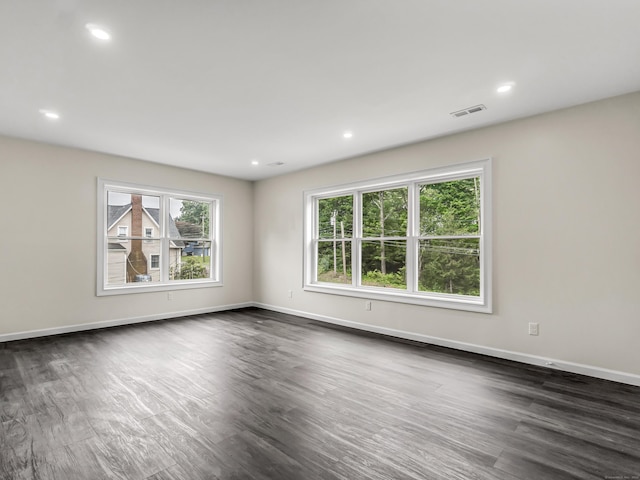 39 Beaver Brook Rd, Danbury, CT 06810 - empty room with dark wood-style floors and recessed lighting