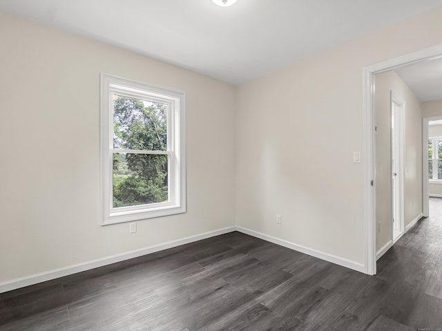 39 Beaver Brook Rd, Danbury, CT 06810 - empty room with dark wood finished floors and baseboards