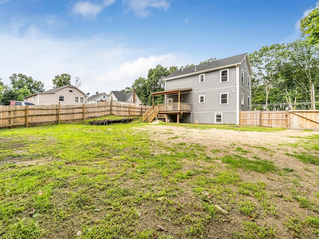 39 Beaver Brook Rd, Danbury, CT 06810 - back of property with stairway, a deck, and a fenced backyard