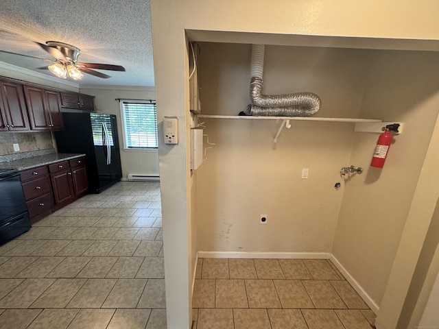 519 Scott Rd, Waterbury, CT 06705 - washroom with electric dryer hookup, a baseboard radiator, light tile patterned floors, ceiling fan, and hookup for a washing machine