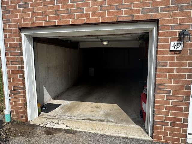 519 Scott Rd, Waterbury, CT 06705 - garage with a garage door opener and driveway
