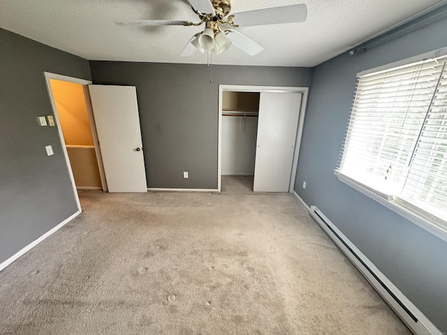 519 Scott Rd, Waterbury, CT 06705 - unfurnished bedroom with baseboard heating, carpet, a closet, a ceiling fan, and a textured ceiling