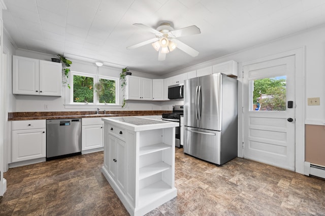 20 Harris St, Enfield, CT 06082 - kitchen with stainless steel appliances, healthy amount of natural light, open shelves, and white cabinetry