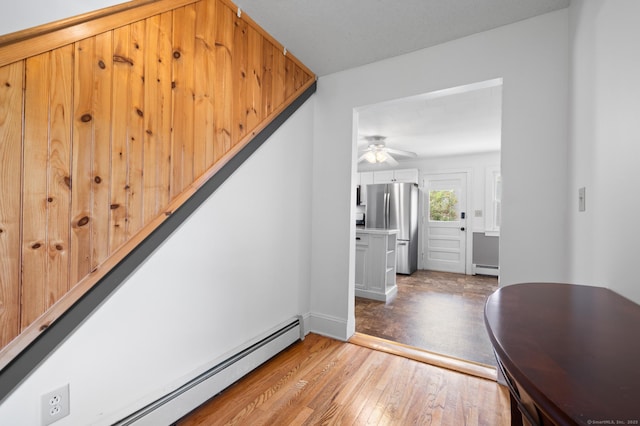 20 Harris St, Enfield, CT 06082 - stairs featuring a baseboard radiator, wood finished floors, and a ceiling fan