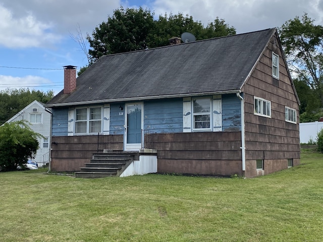 115 Cooper Dr, Waterbury, CT 06704 - view of front of house featuring a chimney, a front lawn, and a shingled roof
