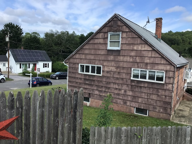 115 Cooper Dr, Waterbury, CT 06704 - view of property exterior featuring a chimney