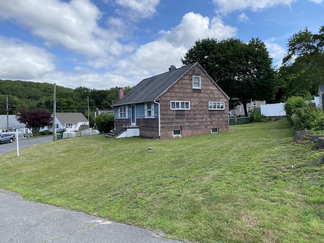 115 Cooper Dr, Waterbury, CT 06704 - view of property exterior featuring a chimney and roof with shingles
