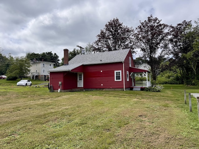 1 Ferry Ln, Portland, CT 06480 - rear view of property with a yard, a chimney, and a shingled roof
