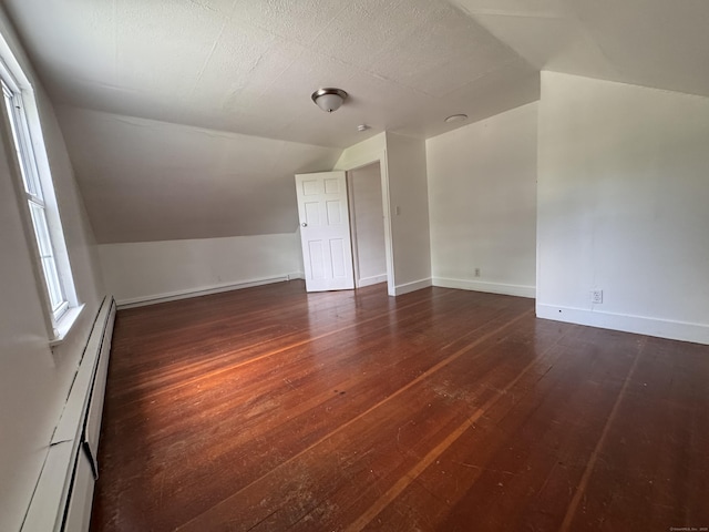 1 Ferry Ln, Portland, CT 06480 - bonus room with vaulted ceiling, a baseboard radiator, and dark wood-style flooring