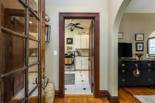 48 Own Home Ave, Wilton, CT 06897 - hall with arched walkways and light wood finished floors