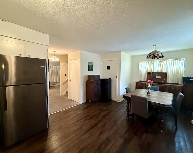 210 Oakville Ave Apt A, Waterbury, CT 06708 - dining space featuring dark wood-style flooring and a textured ceiling