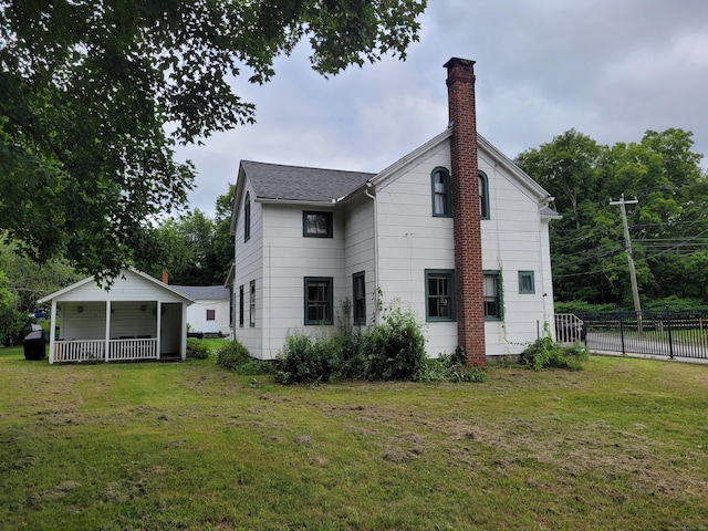 130 Westchester Rd, Colchester, CT 06415 - back of property featuring a chimney, covered porch, and a shingled roof