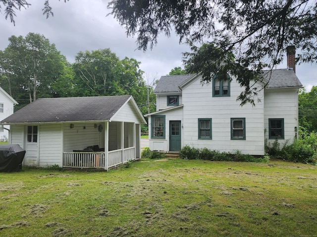 130 Westchester Rd, Colchester, CT 06415 - rear view of property with a chimney, a lawn, a shingled roof, and entry steps