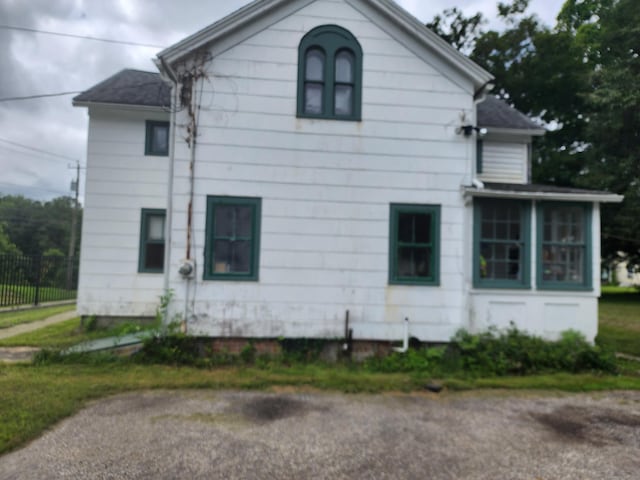 130 Westchester Rd, Colchester, CT 06415 - view of home's exterior with a sunroom and a shingled roof