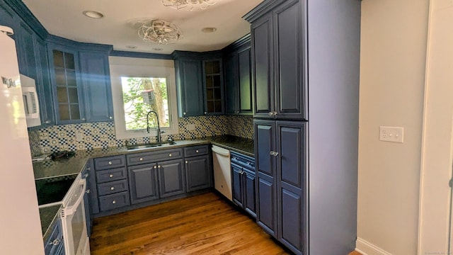 32 Rocky Glen Rd, Danbury, CT 06810 - kitchen with white appliances, wood finished floors, backsplash, dark countertops, and glass insert cabinets