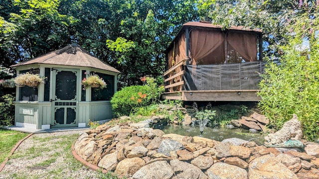 32 Rocky Glen Rd, Danbury, CT 06810 - view of yard with an outdoor structure and a small pond