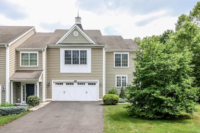 21 Great Heron Ln Unit 21, Brookfield, CT 06804 - view of front of home with roof with shingles, an attached garage, asphalt driveway, and a chimney