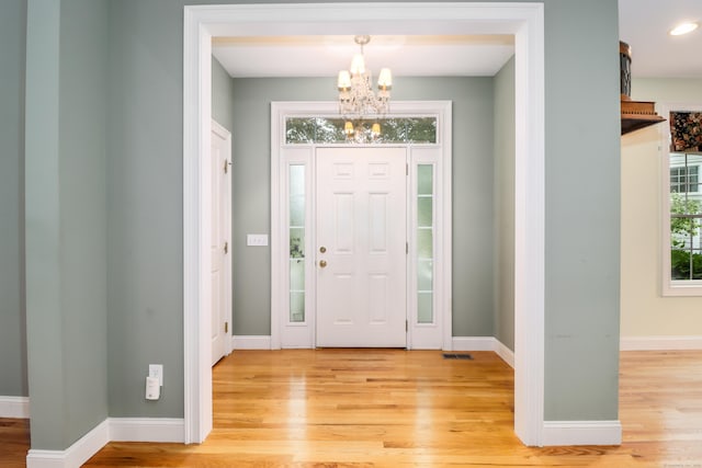 21 Great Heron Ln Unit 21, Brookfield, CT 06804 - foyer entrance with a chandelier and light wood-style floors