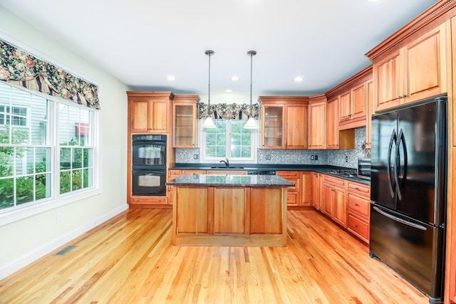 21 Great Heron Ln Unit 21, Brookfield, CT 06804 - kitchen with black appliances, light wood-type flooring, decorative backsplash, and recessed lighting