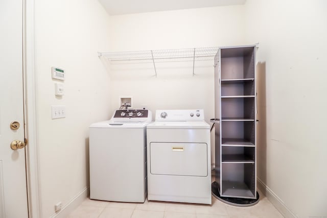 21 Great Heron Ln Unit 21, Brookfield, CT 06804 - laundry room with washer and clothes dryer and light tile patterned flooring