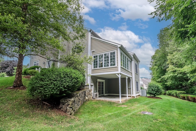 21 Great Heron Ln Unit 21, Brookfield, CT 06804 - rear view of property with a patio and a lawn