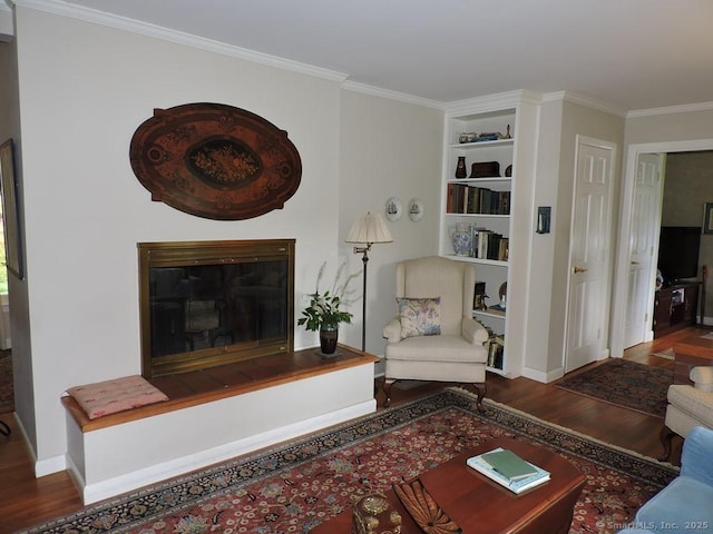 29 Graham Rd, East Windsor, CT 06016 - living area with wood finished floors, built in shelves, and ornamental molding
