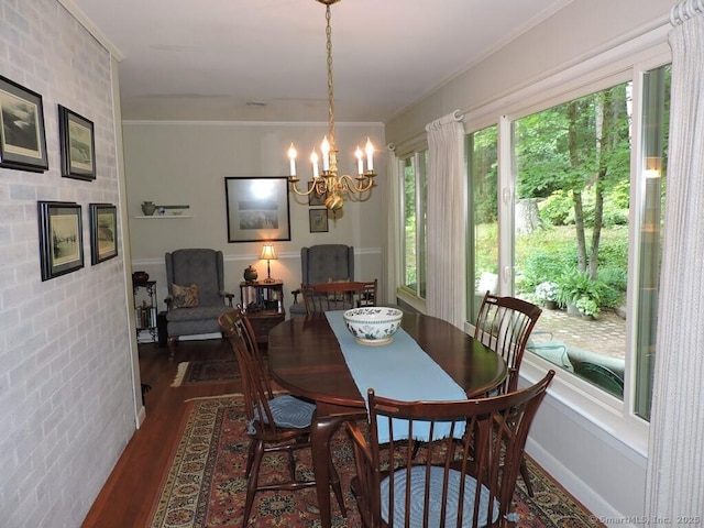 29 Graham Rd, East Windsor, CT 06016 - dining space with dark wood-style floors, crown molding, and a chandelier