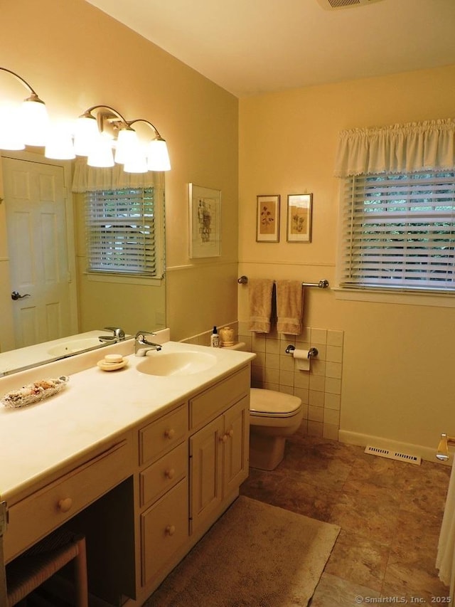 29 Graham Rd, East Windsor, CT 06016 - bathroom with vanity and tile walls