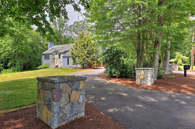 35 Millo Dr, Monroe, CT 06468 - view of front of house featuring a chimney and a front yard