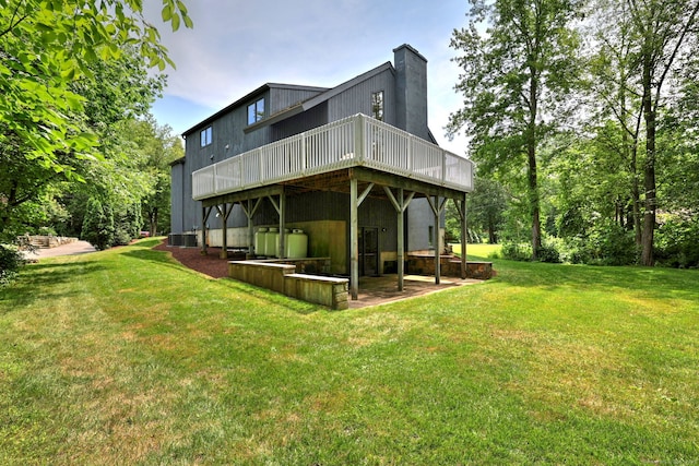 35 Millo Dr, Monroe, CT 06468 - rear view of property with a wooden deck, a yard, and a chimney