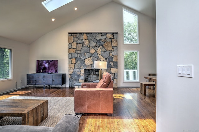 35 Millo Dr, Monroe, CT 06468 - living room with a skylight, wood finished floors, high vaulted ceiling, a stone fireplace, and recessed lighting