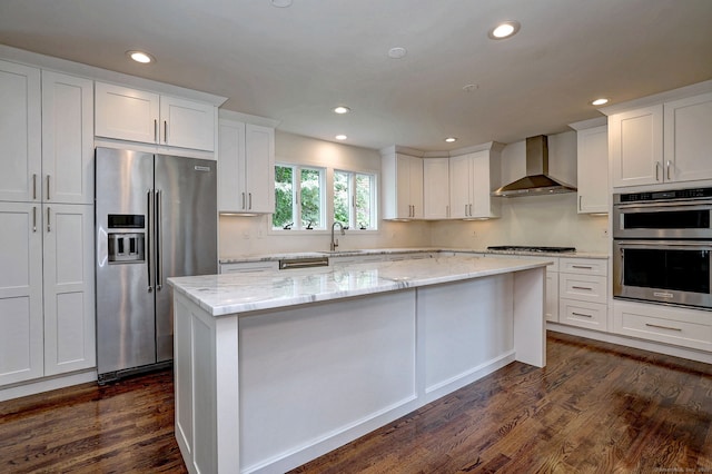 35 Millo Dr, Monroe, CT 06468 - kitchen with appliances with stainless steel finishes, dark wood-style floors, white cabinetry, recessed lighting, and wall chimney exhaust hood