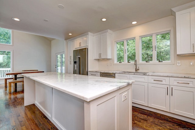35 Millo Dr, Monroe, CT 06468 - kitchen with recessed lighting, a kitchen island, high end refrigerator, white cabinets, and light stone countertops