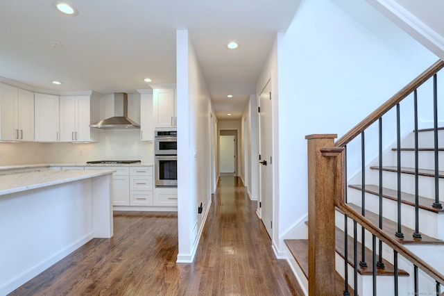 35 Millo Dr, Monroe, CT 06468 - kitchen with wall chimney exhaust hood, dark wood finished floors, recessed lighting, white cabinets, and light stone counters
