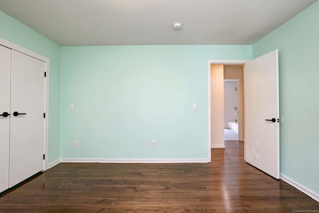 35 Millo Dr, Monroe, CT 06468 - unfurnished bedroom with dark wood-style floors and a closet