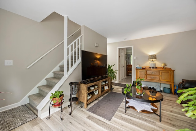 152 Lincoln St Unit 17, Waterbury, CT 06710 - living room with stairs and light wood-style floors