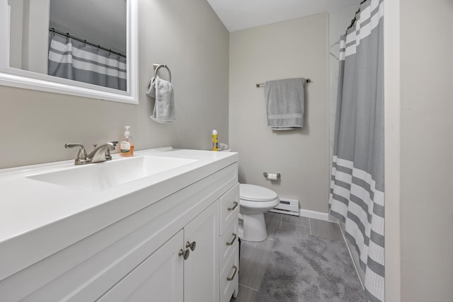 152 Lincoln St Unit 17, Waterbury, CT 06710 - bathroom with vanity, a baseboard heating unit, and a shower with curtain