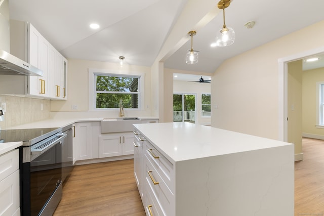 145 Lakeview Dr, Colchester, CT 06415 - kitchen featuring appliances with stainless steel finishes, wall chimney exhaust hood, light wood finished floors, white cabinetry, and ceiling fan