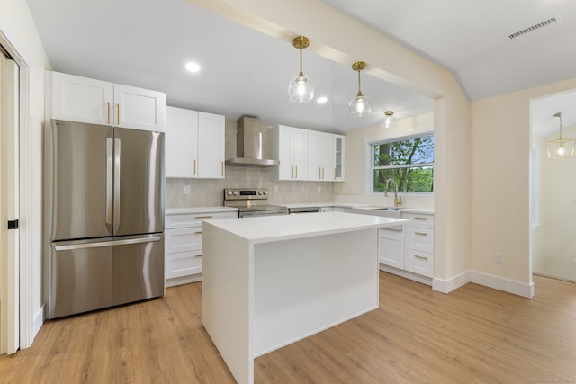 145 Lakeview Dr, Colchester, CT 06415 - kitchen with appliances with stainless steel finishes, white cabinetry, light wood-style flooring, lofted ceiling, and recessed lighting